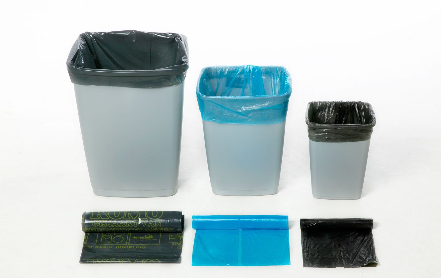 three rubbish bins of descending size, with a bin liner in each