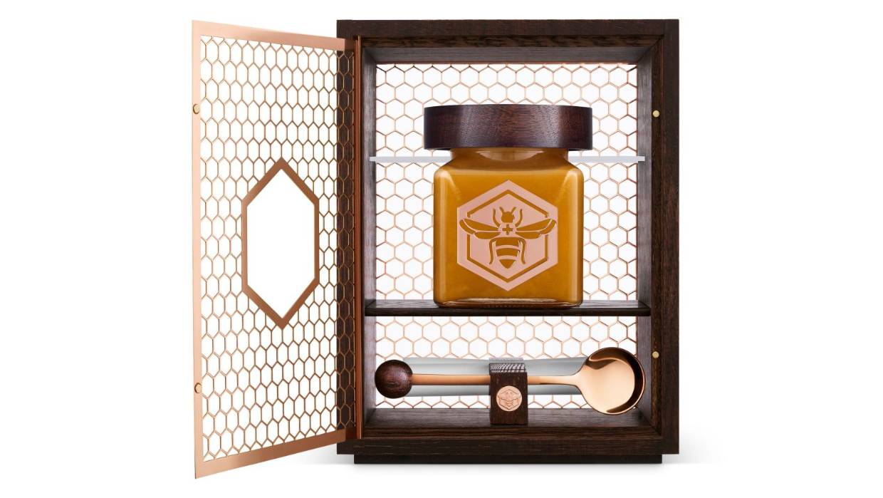 manuka south's $1800 honey jar laid in an oax box with a golden spoon