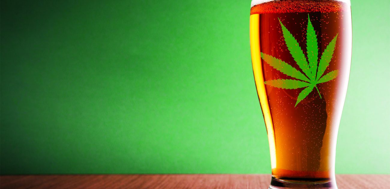 beer in a glass with a marijuana leaf on it