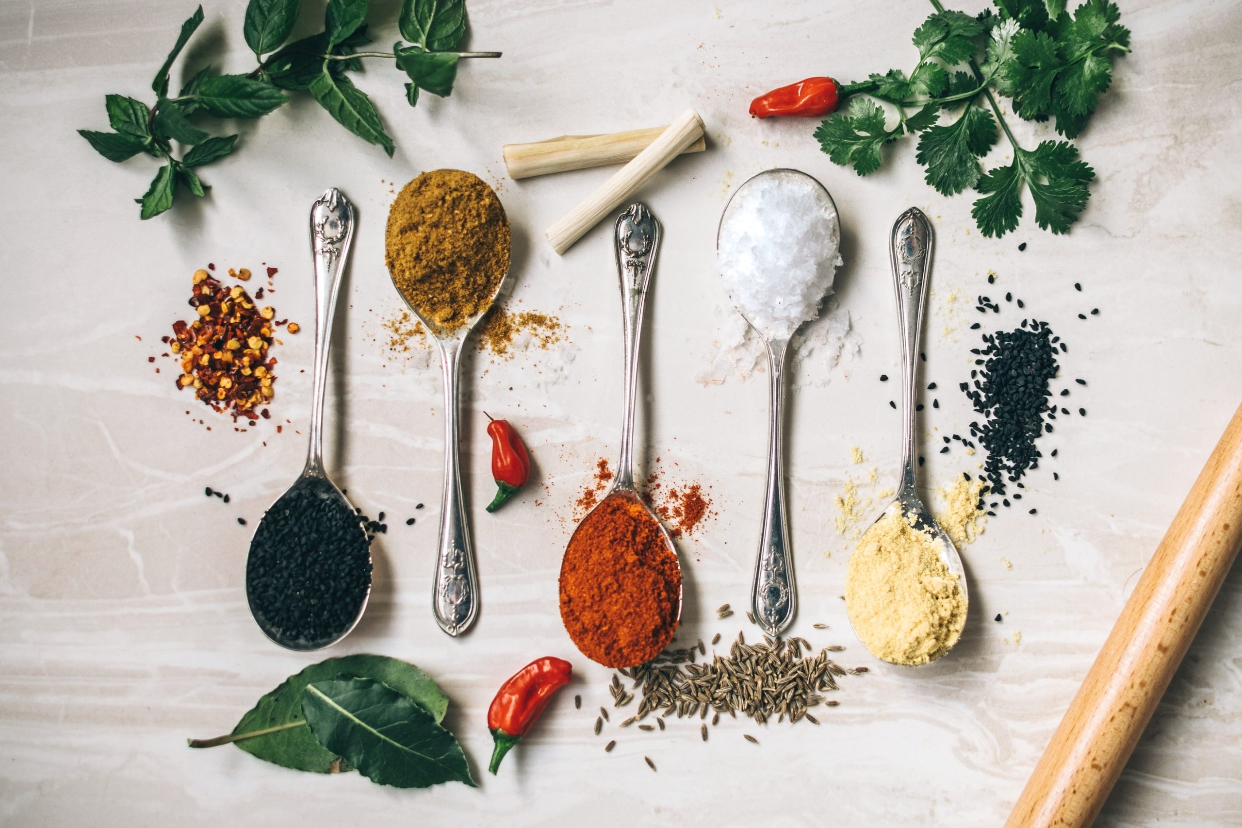 seasonings and spices in spoons